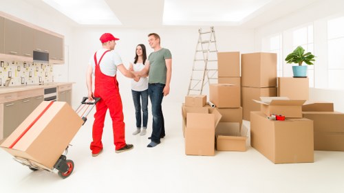 Careful packing of fragile household items for a Belsizepark move