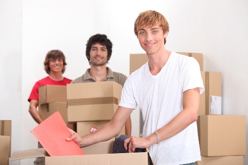 Packing boxes and furniture prepared for a Belsizepark flat move